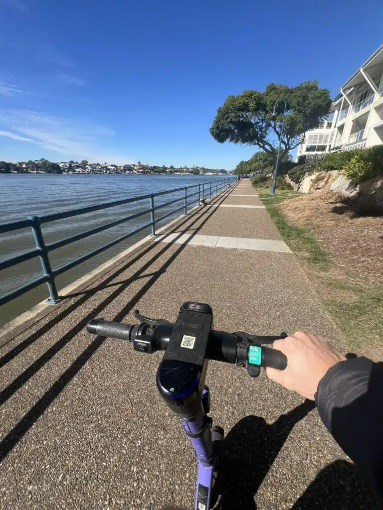 Scootering along Brisbane River Boardwalk